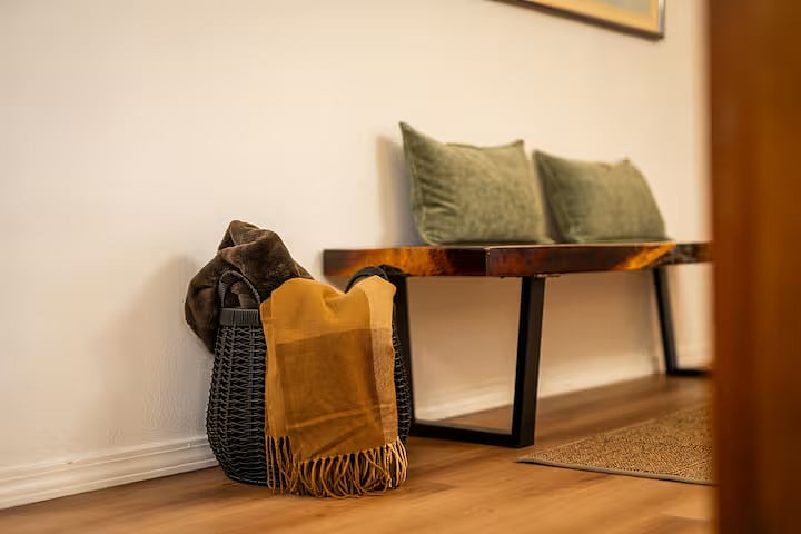 A live edge bench for additional seating. Multiple throw blankets are provided.