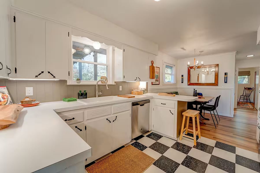 The fully appointed kitchen with the dining area.