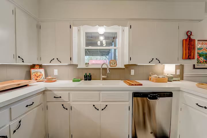 The window over the sink looks out to the large backyard. The newer dishwasher makes cleanup a breeze!