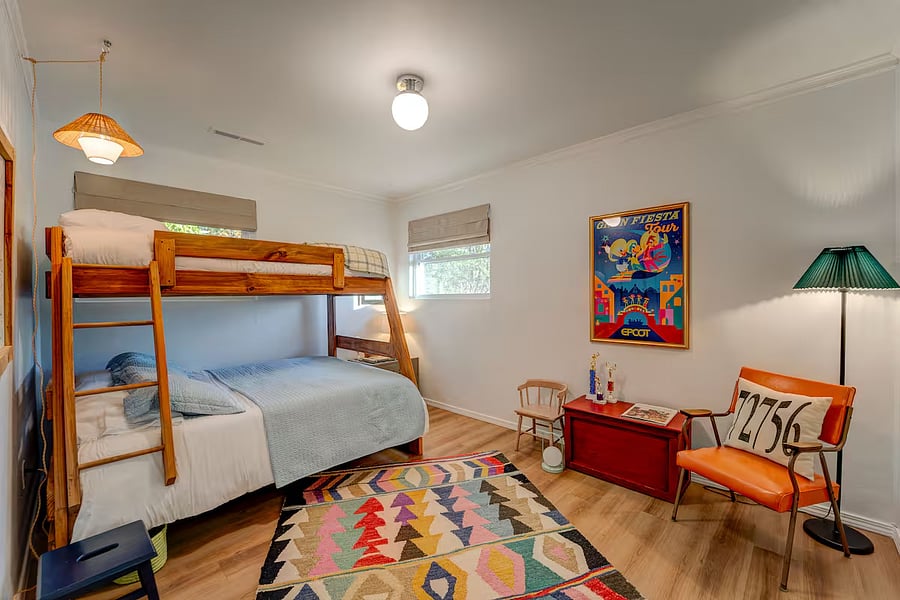Creative and colorful with inspiring art and design for both young and older guests! Full/twin bunk bed with full size, medium-firm, non-toxic mattress on bottom and single/twin size, medium-firm mattress on top.