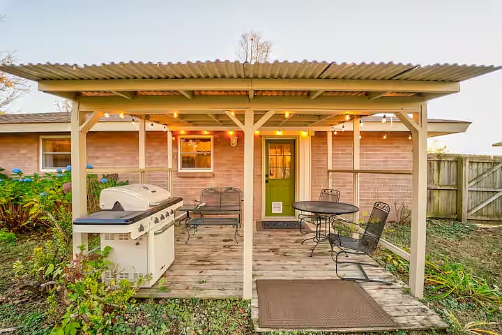 The covered back porch is perfect for spending time outside day & night. The dining table with chairs & gliding bench are comfortable for eating & relaxing. String lights will auto turn on at dusk. The remote control is inside above kitchen sink.