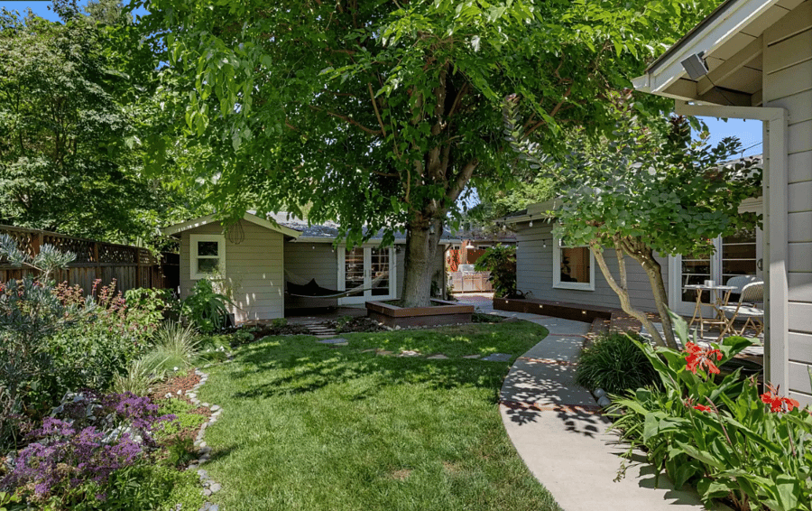 Your own secluded cottage tucked behind the main house and nestled under a mulberry tree (owner's residence to the right)