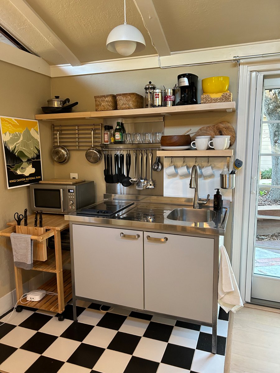 Small but mighty, fully equipped kitchenette with sink, 2-burner electric range, mini-fridge (in cabinet), microwave, toaster oven & coffee maker