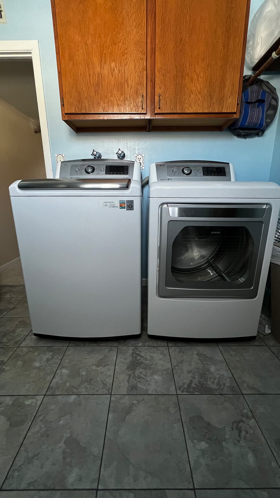 Full-size washer and dryer available in the shared lower-level laundry room.