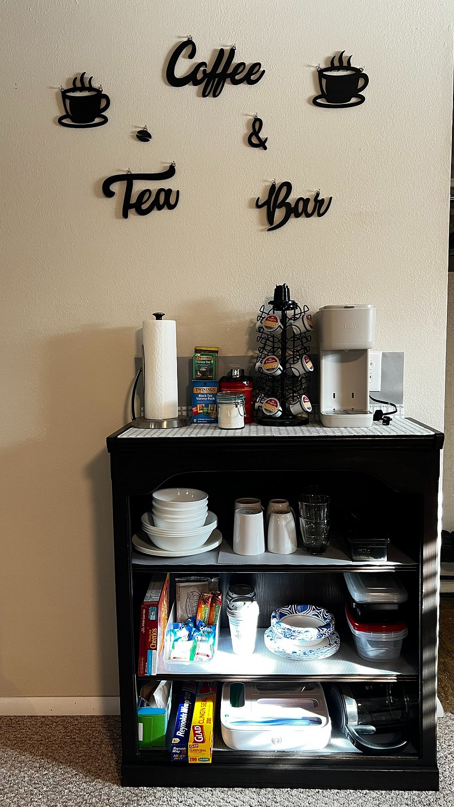 The kitchenette corner is stocked for light meals and easy mornings.
