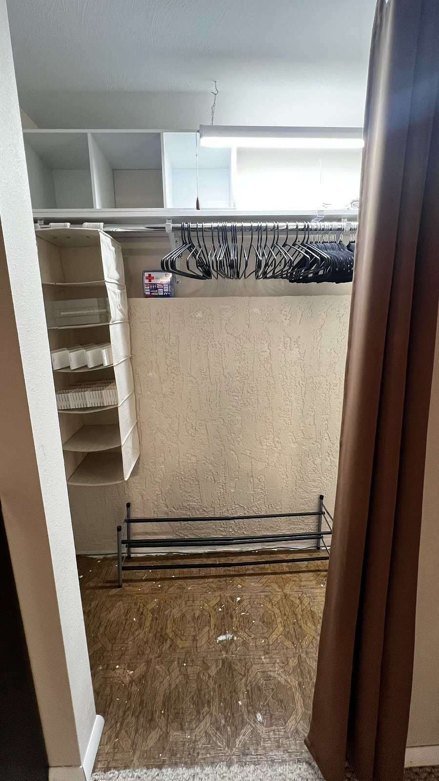 Large walk-in closet provides ample space for luggage and personal belongings. 