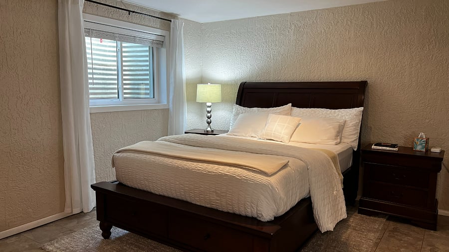 Queen-size bed with large under-bed storage drawers.