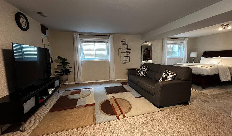 Unwind in the cozy living area with a 65" Smart TV for streaming your favorite shows. 