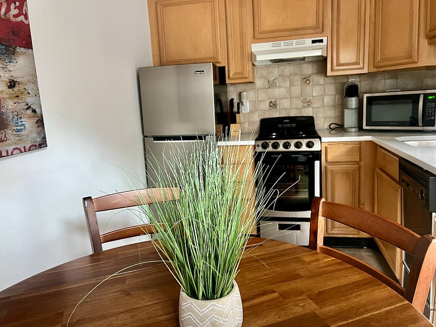 Kitchen with new stainless steel fridge/freezer, gas stove/oven, microwave, dishwasher, and Keurig