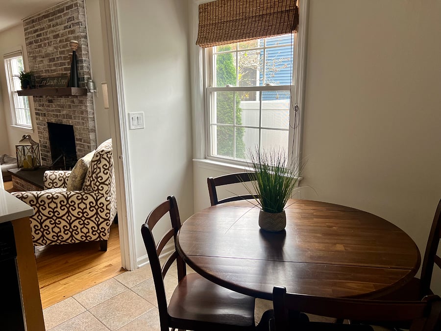 Kitchen table off of living room, with window