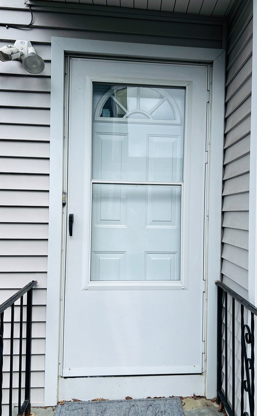 Private front entrance to unit accessed via well-lit sidewalk.