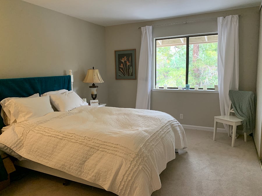 Larger bedroom with view of sunrise.