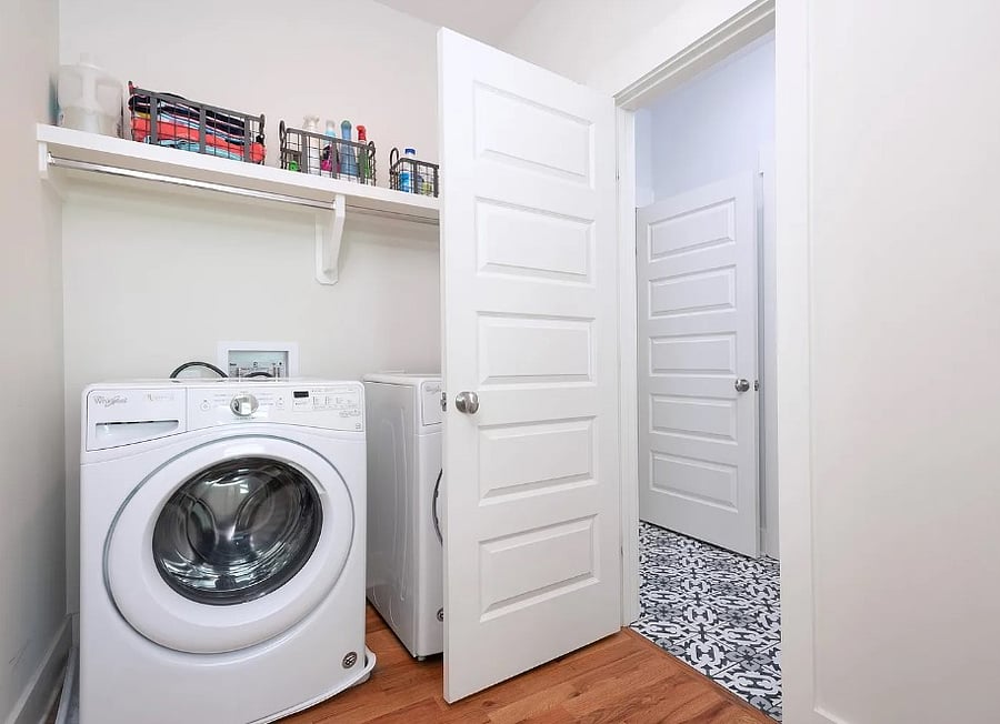 Laundry room (off hallway and primary bathroom)