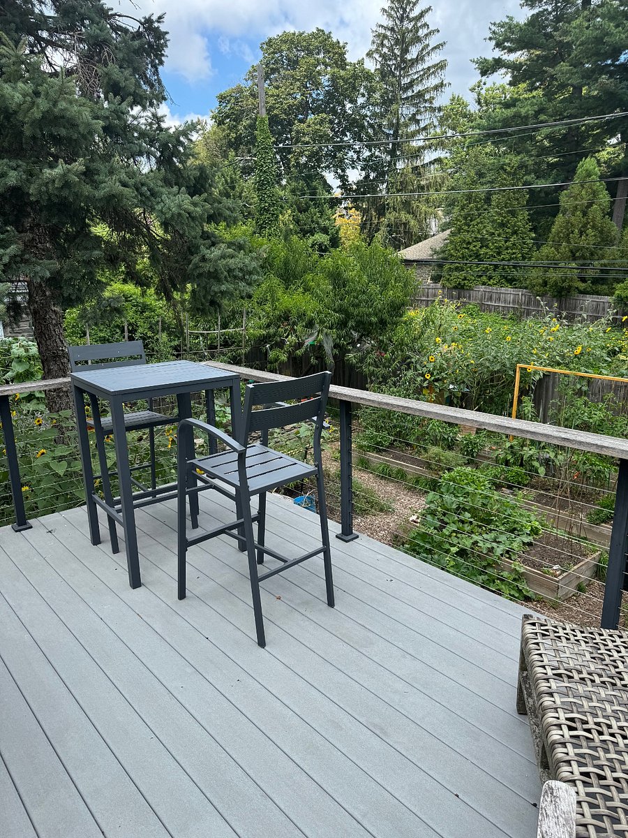 Table and chairs on outdoor porch overlooking the garden!