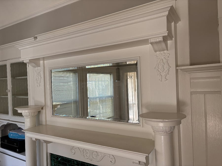craftsman wood details in dining room. Leaded glass cabinet and original deco tile (nonfunctional ) fireplace.