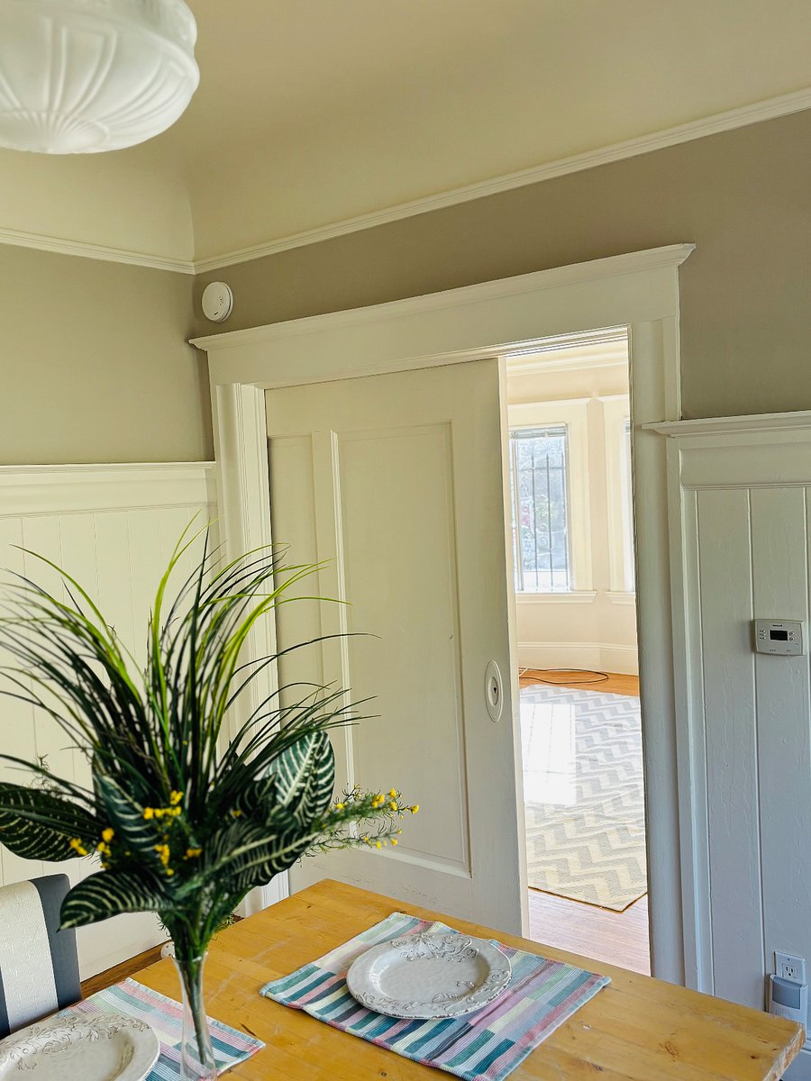 Dining Room and Living Room through beautiful French sliding door.