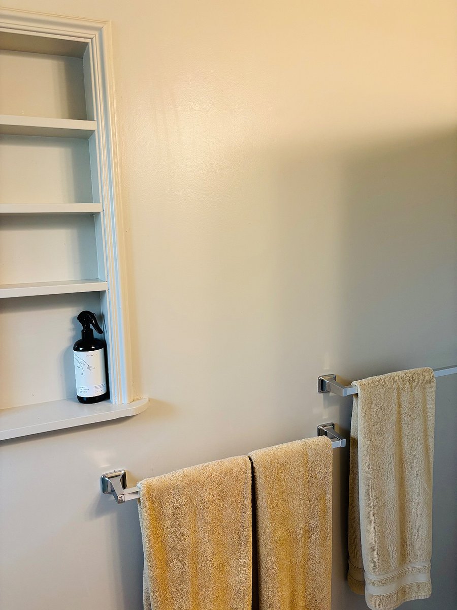 Bathroom towels and built in shelves.
