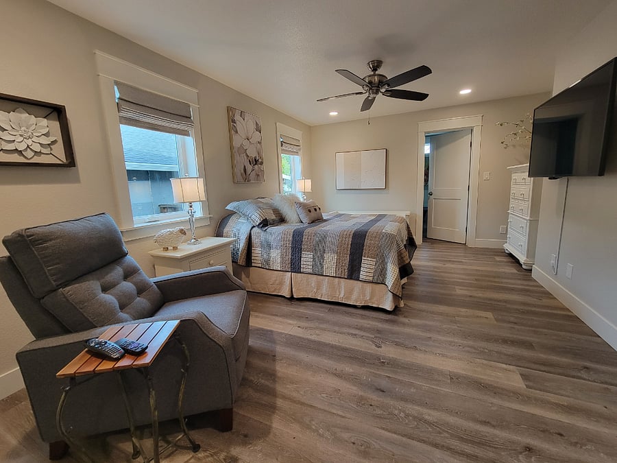 Primary Suite with Queen bed and recliner chair