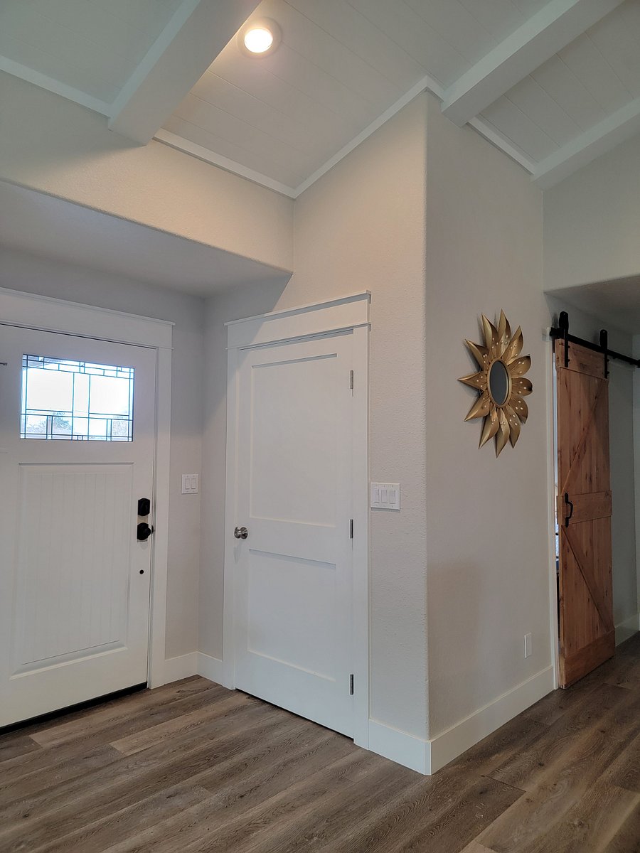 Entry way with large closet storage, a shelf for keys, phone..