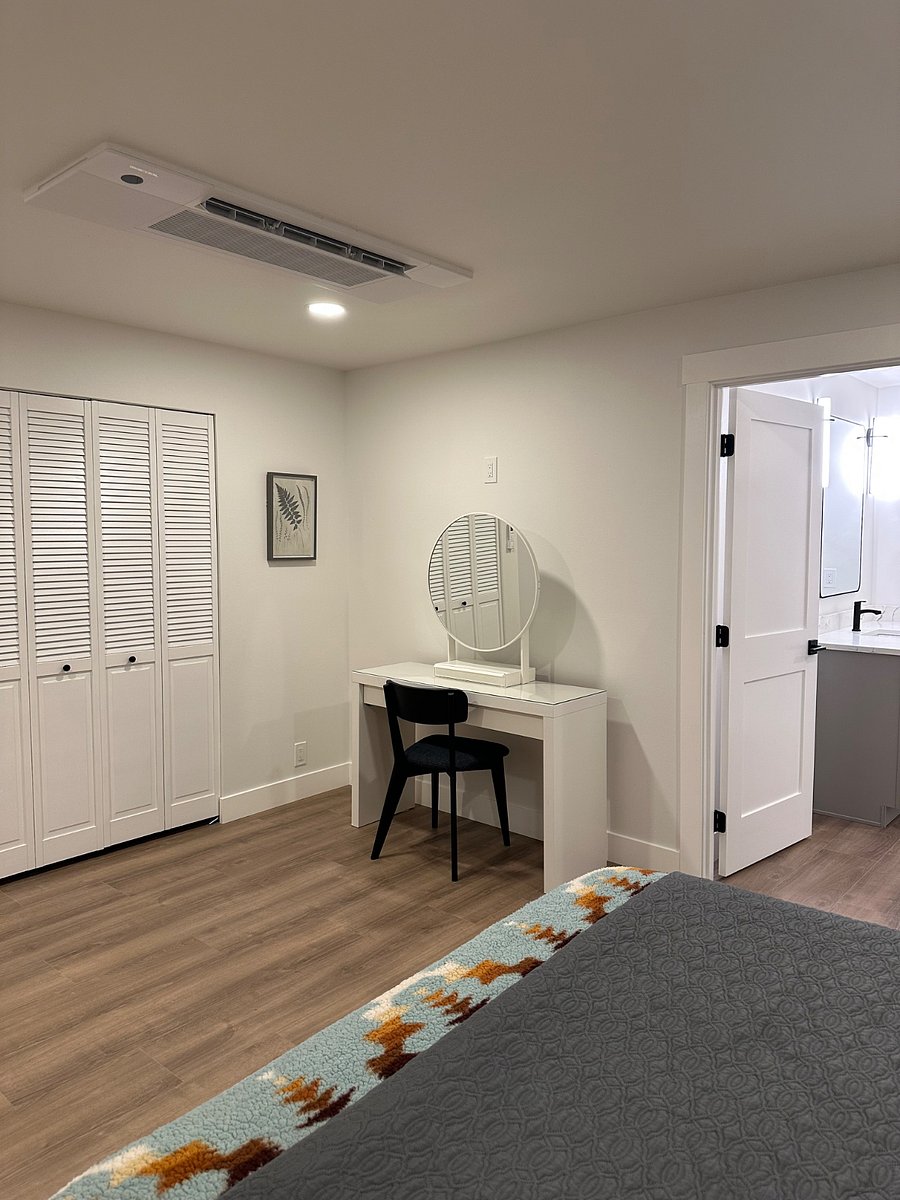 Second bedroom with side exterior door and minibar with fridge.