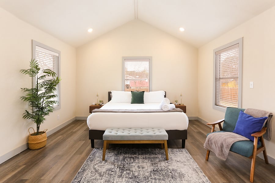 Primary Bedroom with high ceilings and bathroom ensuite.
