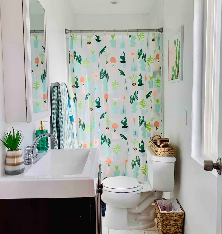 Bathroom with walk-in shower and stocked bathroom essentials.