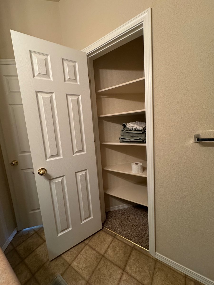 Huge linen closet in bathroom for additional storage