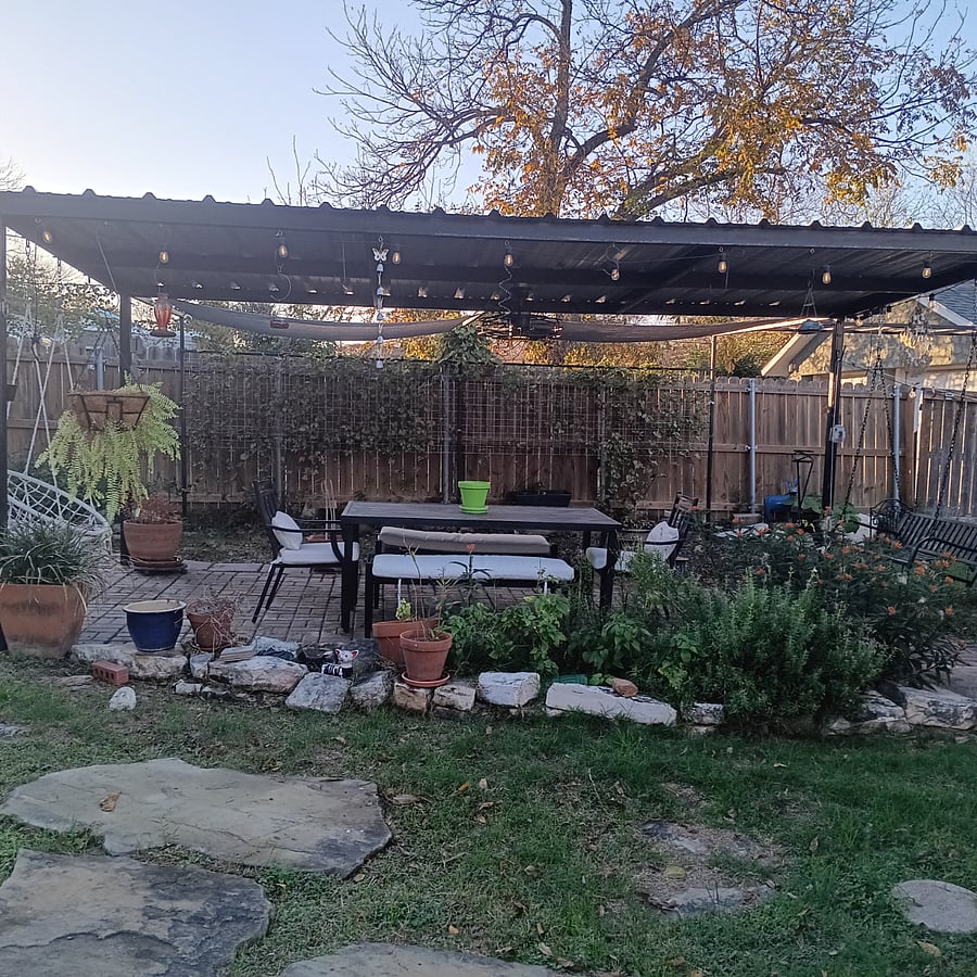 Auto porch with an outdoor ceiling fan & a sitting area to have breakfast or dinner outside