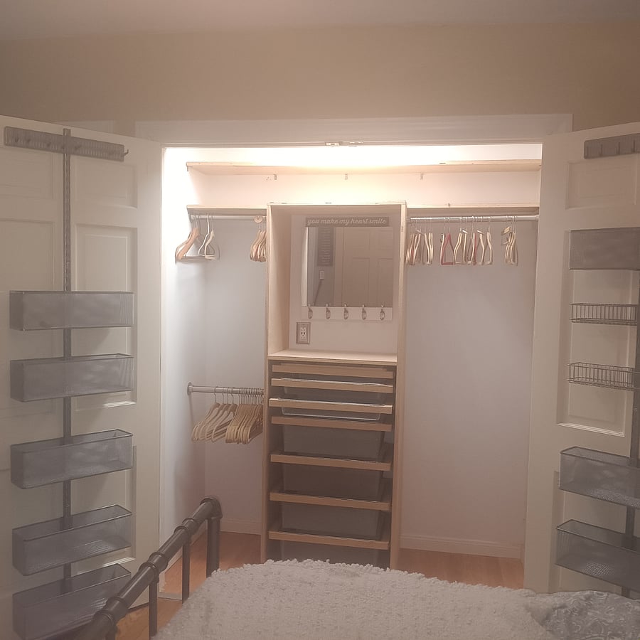 Master bedroom has two large closets. One closet has a mirror with plenty of storage