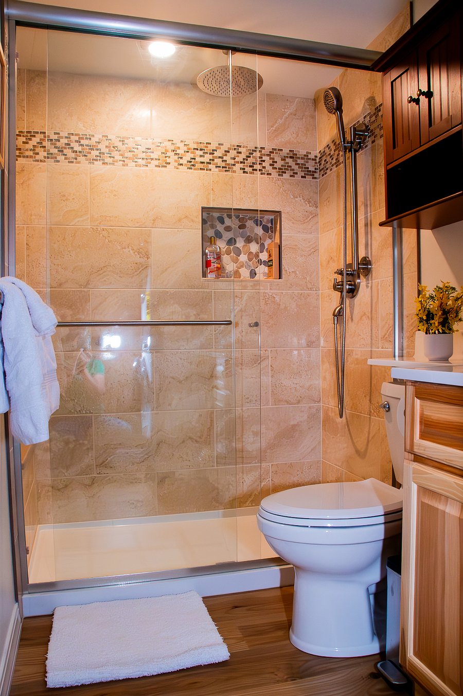 Large shower with a seat (to the left, not shown) and dual shower heads, one as a rain shower for your luxury.
