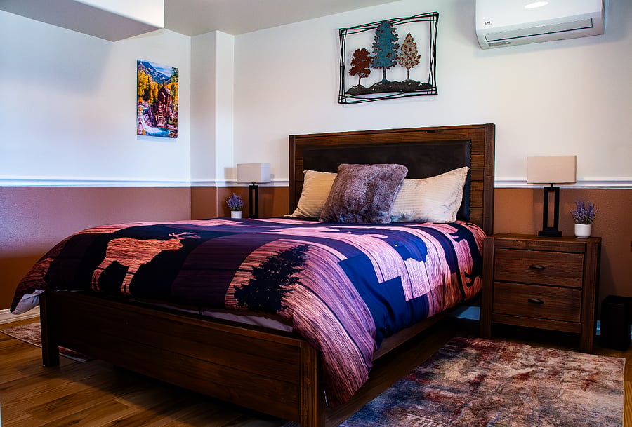 Bedroom looking in from the door. The head and feet of the bed can raise up and down. The unit on the wall is your temperature control.