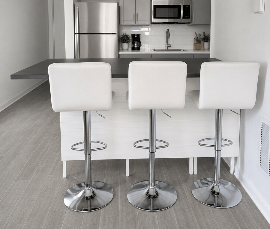 The kitchen features a counter with additional seating, perfect for casual dining.