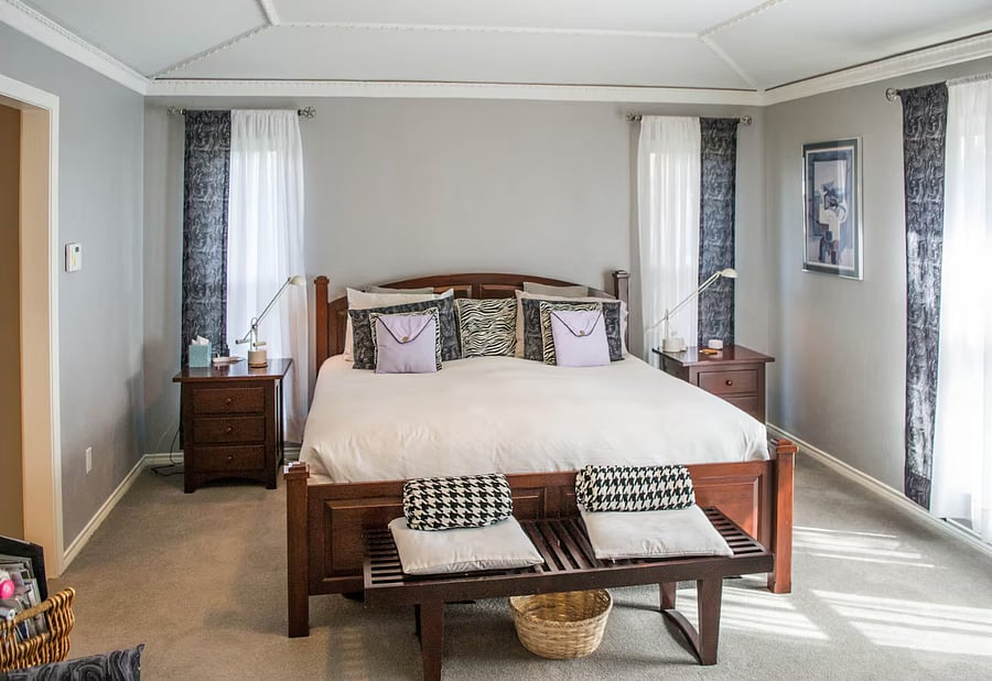 The Primary Bedroom is a sanctuary of peace with calming hues, comfy pillows and a king bed.