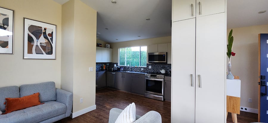 Full-sized kitchen with gas stove, range, built-in microwave, a full-size dishwasher, and fridge.