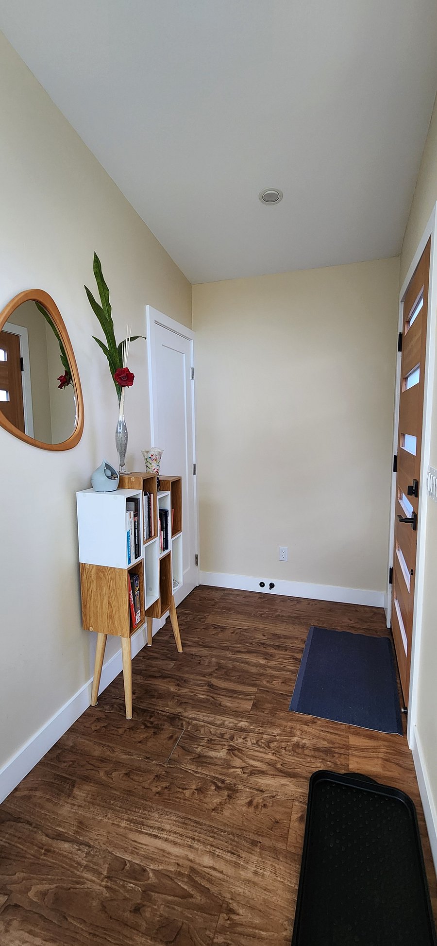 A welcoming entry to drop your keys and hang your coat and hat in the coat closet.