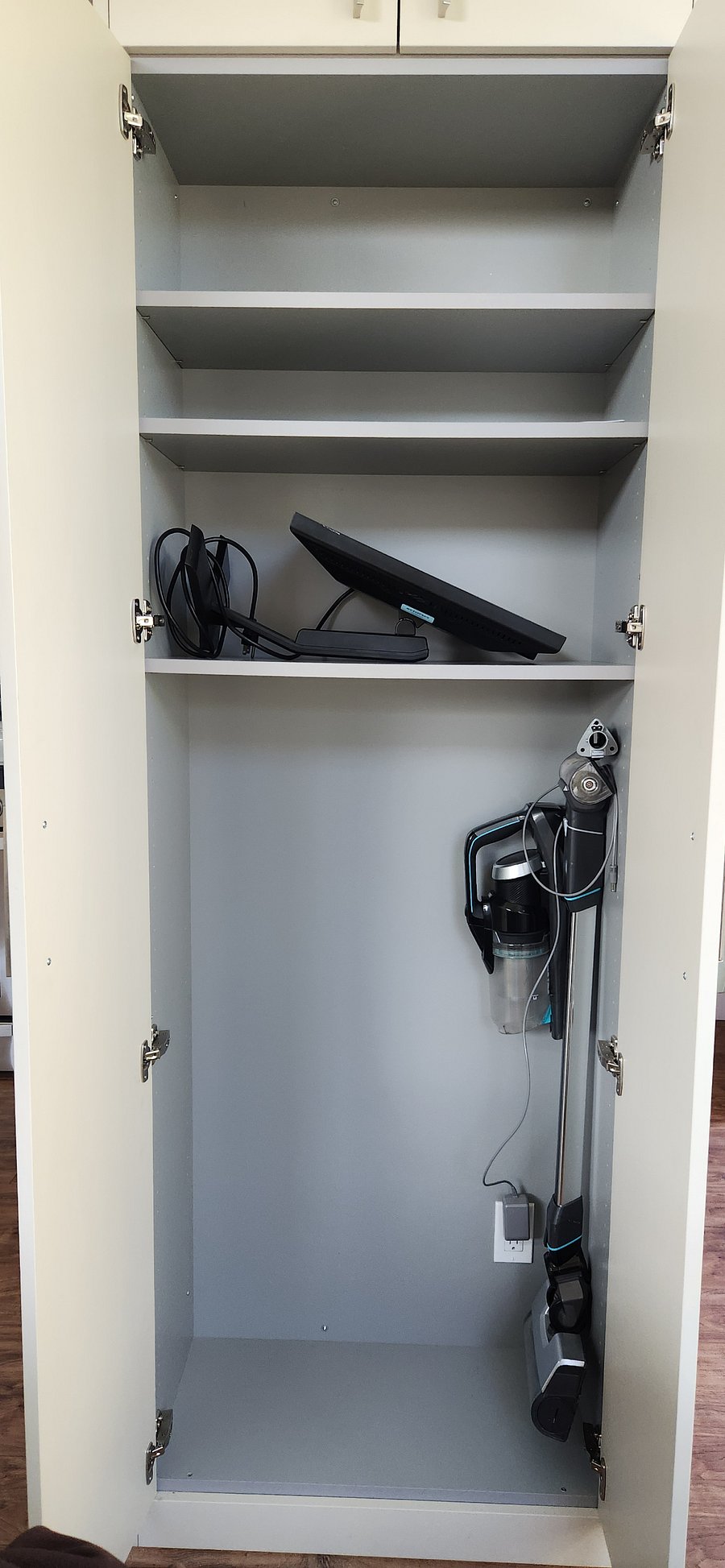 Stick vacuum with charging station and extra monitor are ready for you.