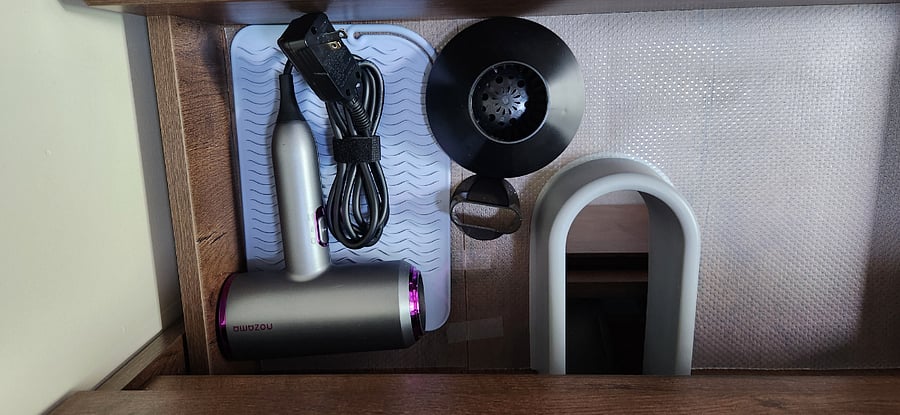 Hair dryer with various attachments.