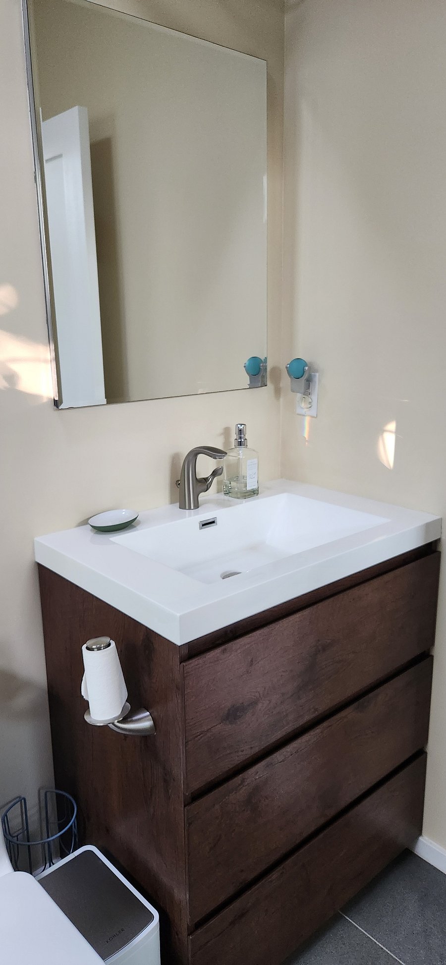 Sink, vanity with lots of storage, a d a mirror cabinet with extra outlet for your electric toothbrush, shaver, etc.