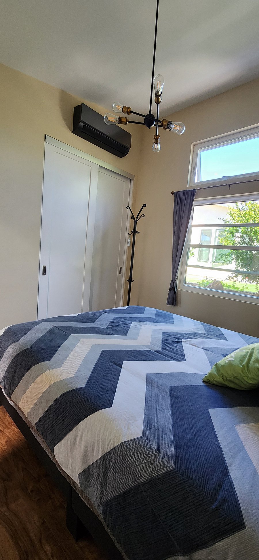Blackout curtains and a top-down/bottom-up blinds will add extra privacy and darken the bedroom.
