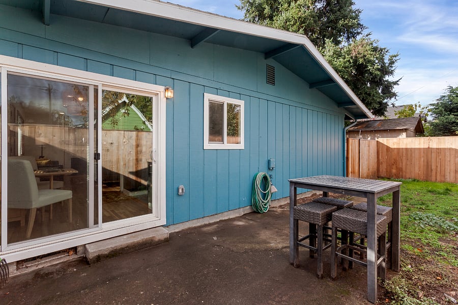 Fenced and gated backyard with access into dining nook/kitchen as well as access to basement washer/dryer