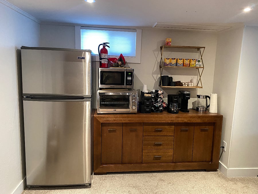 Kitchenette with full fridge, microwave, toaster oven and other amenities 