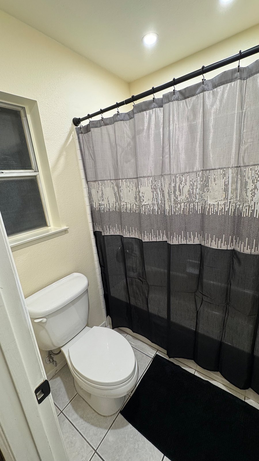 Bathtub and massage shower are located separate from the vanity