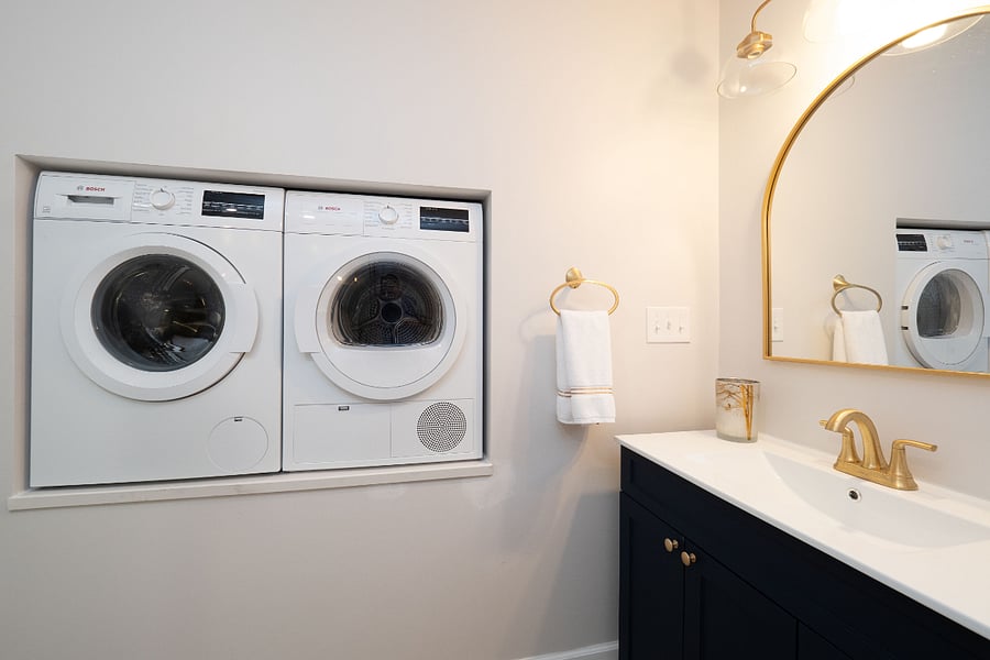 Cleverly situated in a "pocket" in the bathroom you do not have to leave your home to do laundry