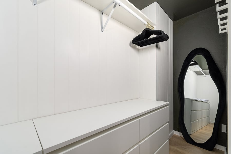 Large double built-in dressers with laundry hamper and basket, hangers and cordless vacuum.