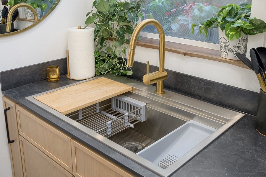 Deep sink with built in drain rack, washing station and cutting board
