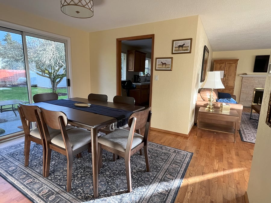 Dining room with vies into kitchen and living room