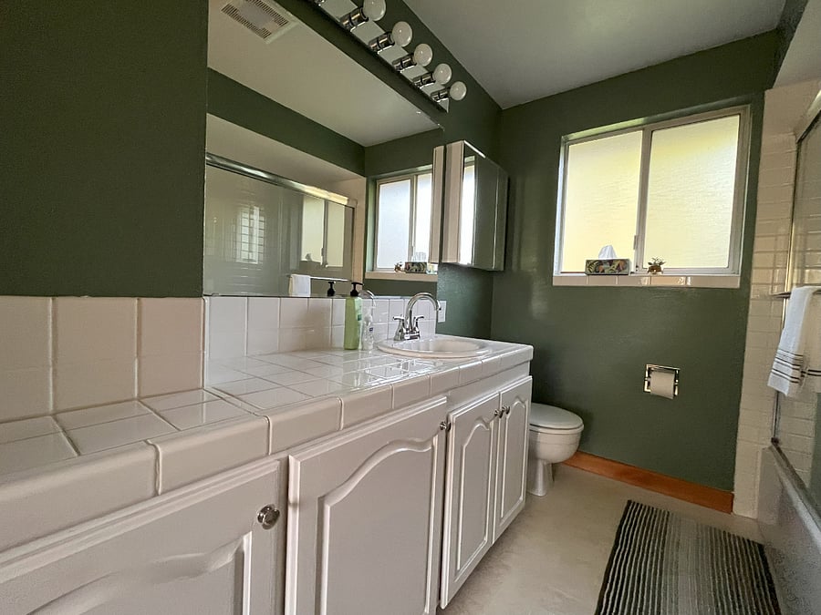 Main bathroom with tub and shower