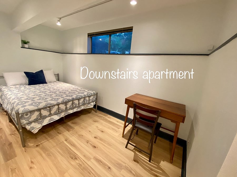 Bedroom with queen bed and smart TV