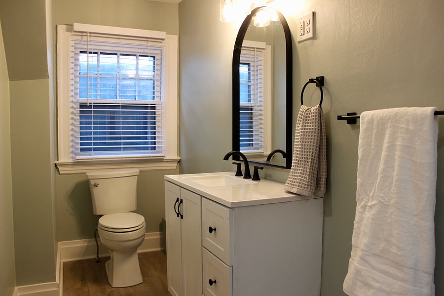 Well stocked vanity and new toilet in the bathroom