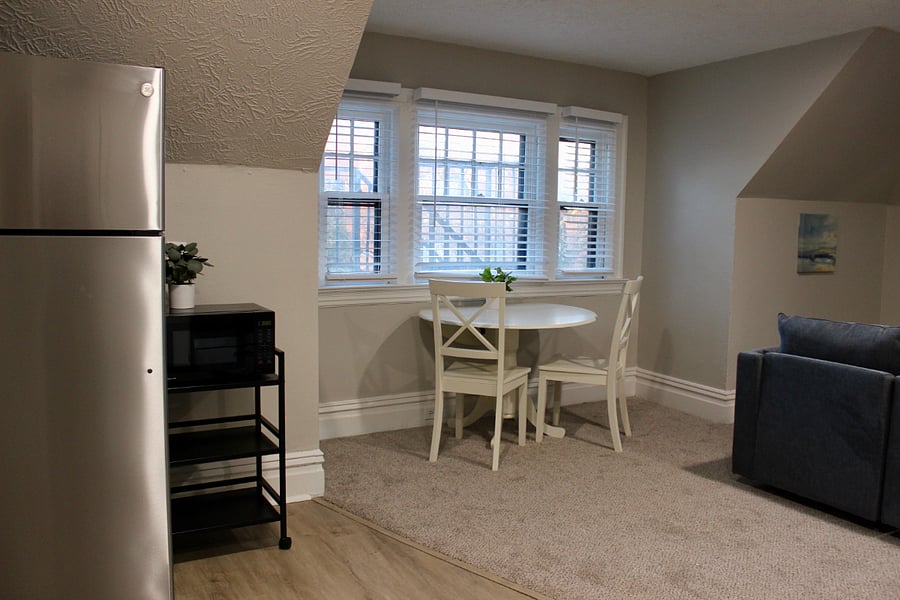 The kitchen opens to the spacious dining and living room space
